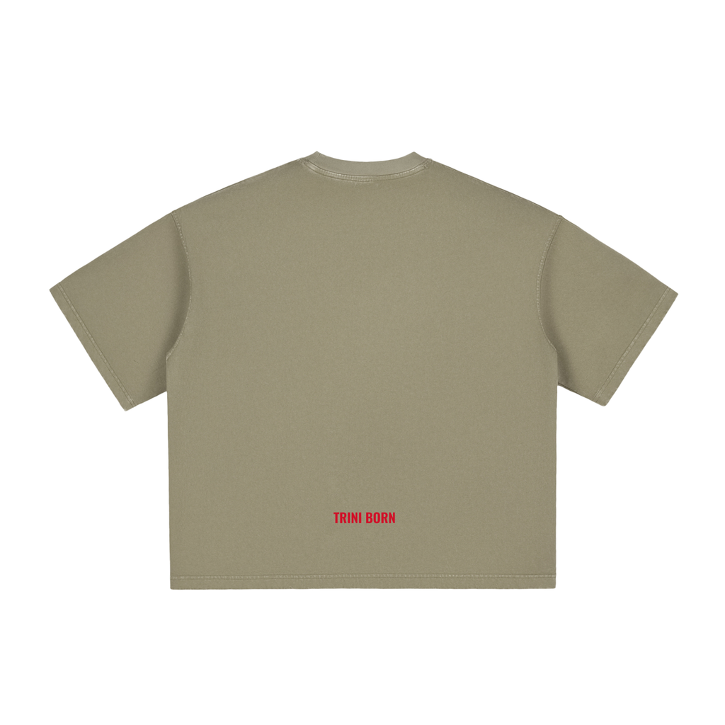 Back view of the Trini Born Culture Tee Arrival Edition in gray green featuring the signature red Trini Born logo at the lower back. Premium oversized boxy fit Caribbean heritage apparel made for everyday wear.