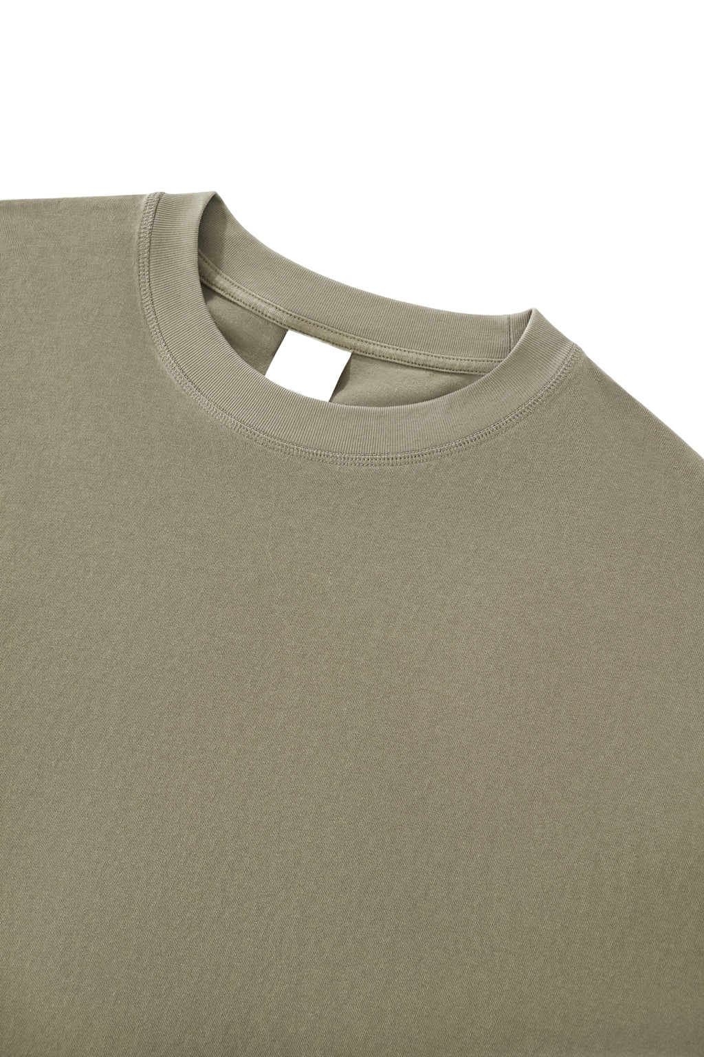 Close-up of the Trini Born Culture Tee Arrival Edition ribbed crew neckline featuring premium heavyweight cotton, reinforced stitching, and a clean oversized boxy silhouette.