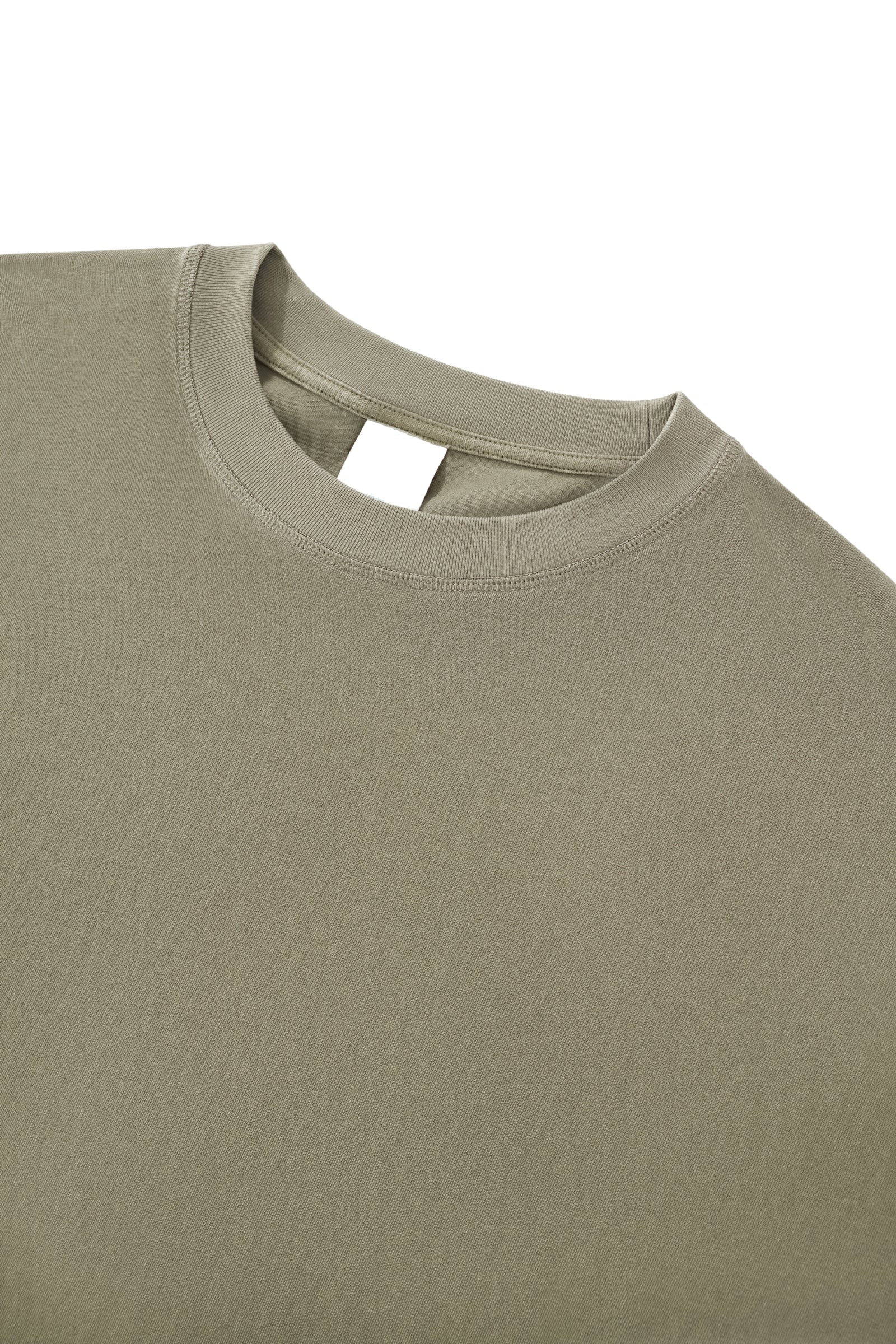 Close-up of the Trini Born Culture Tee Arrival Edition ribbed crew neckline featuring premium heavyweight cotton, reinforced stitching, and a clean oversized boxy silhouette.
