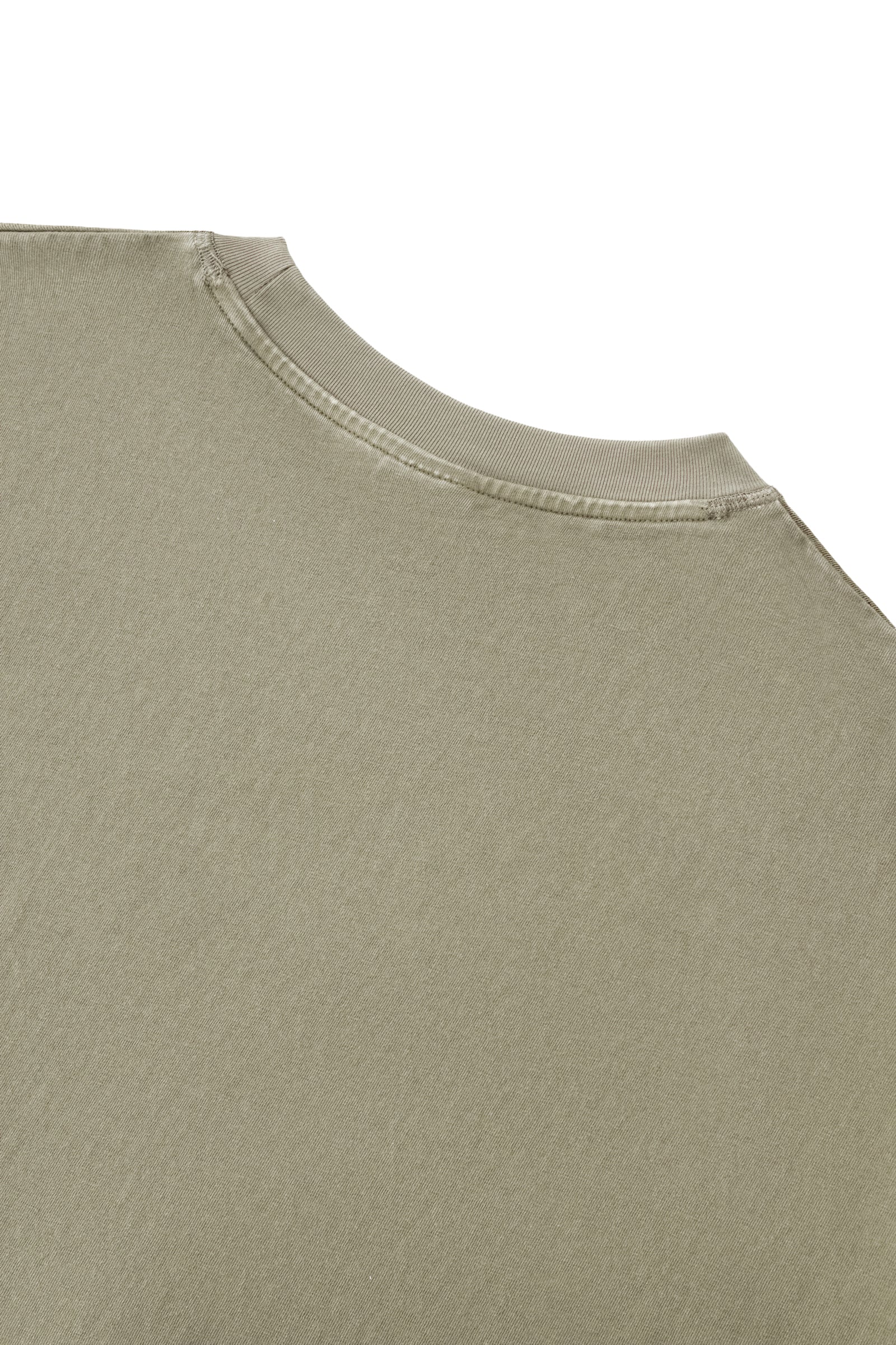 Back neckline detail of the Trini Born Culture Tee Arrival Edition highlighting reinforced ribbed collar construction, premium heavyweight cotton fabric, and quality craftsmanship designed for lasting wear.