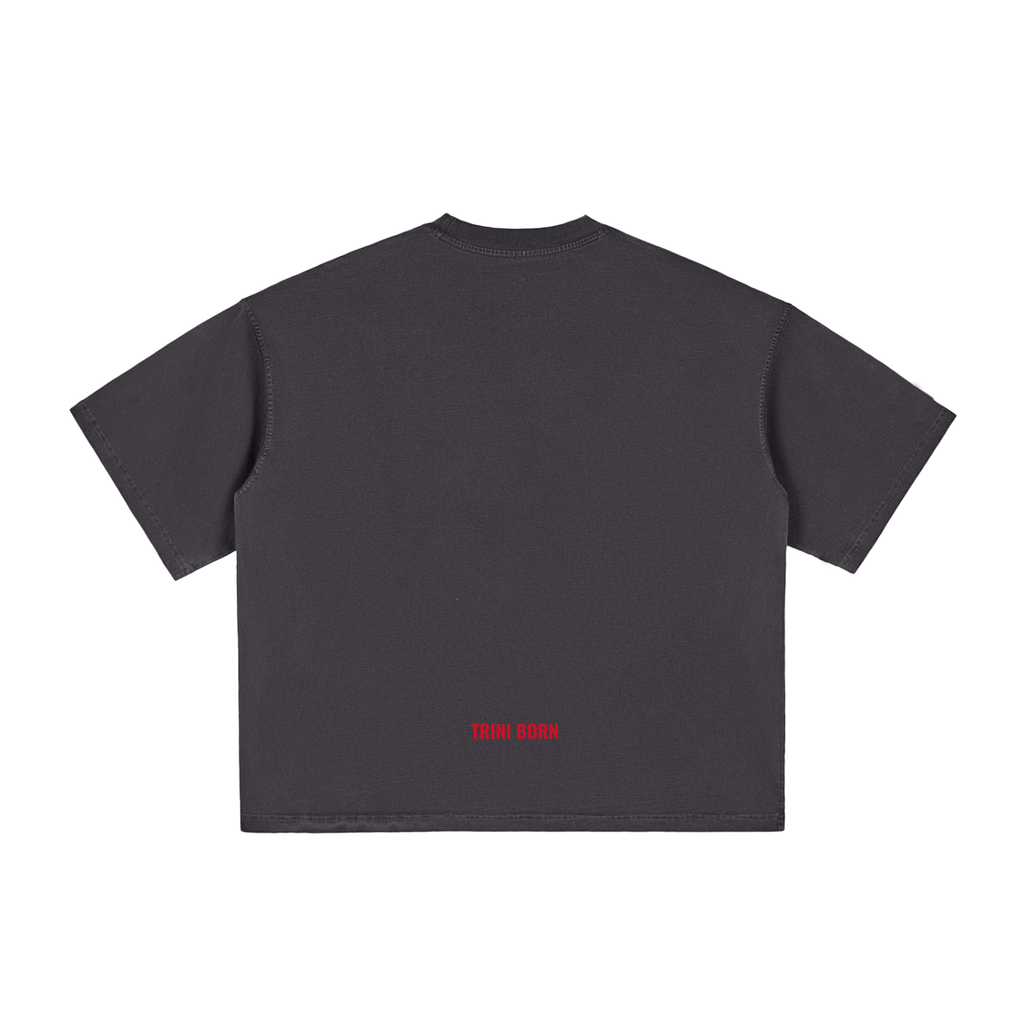 Back view of the Trini Born Culture Tee Arrival Edition in charcoal featuring the signature red Trini Born logo at the lower back. Premium oversized boxy fit Caribbean streetwear inspired by Trinidad and Tobago culture.