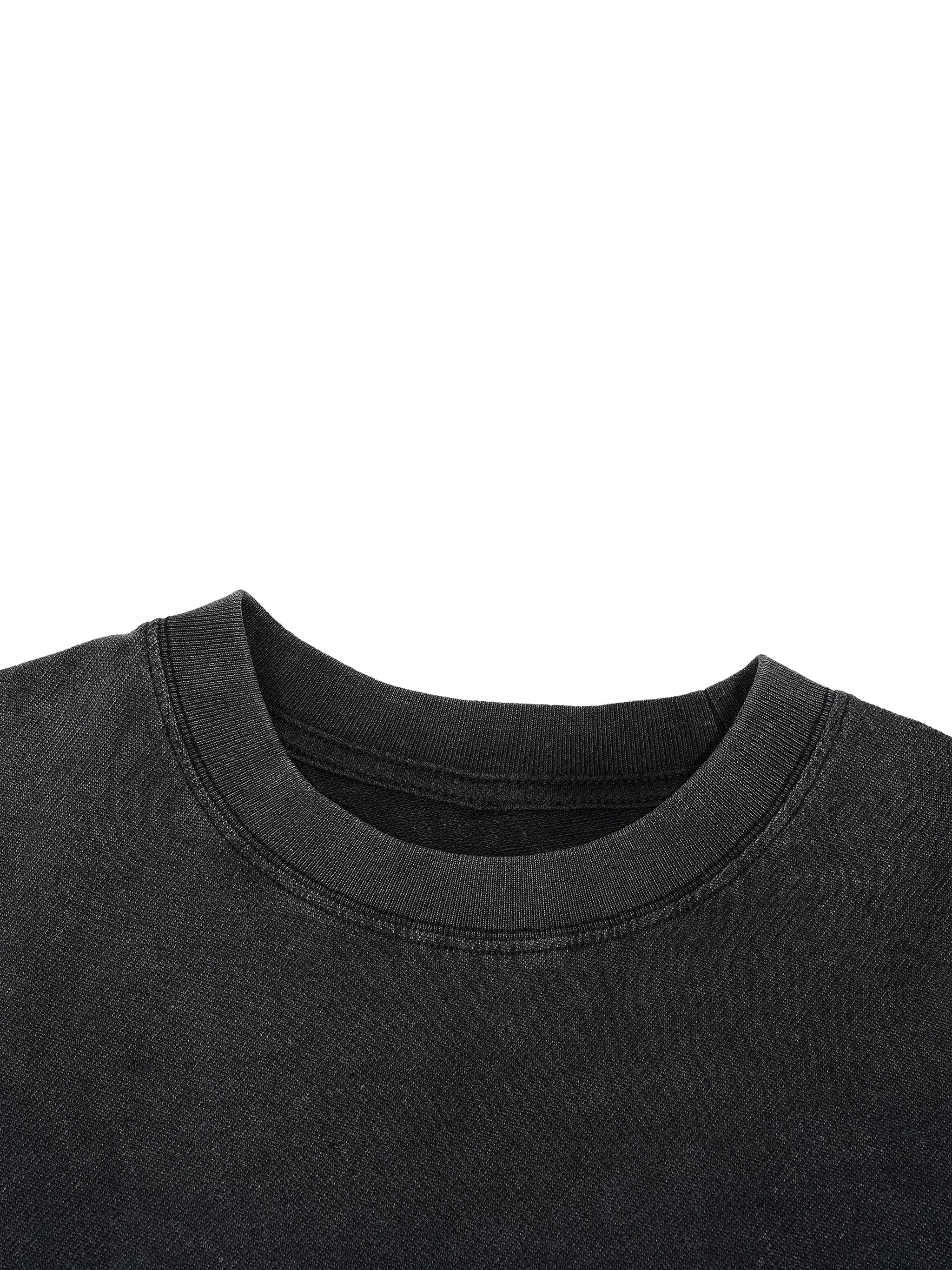 Crewneck collar detail on washed black Trini Born Culture Tee showing ribbed neckline and sturdy stitching