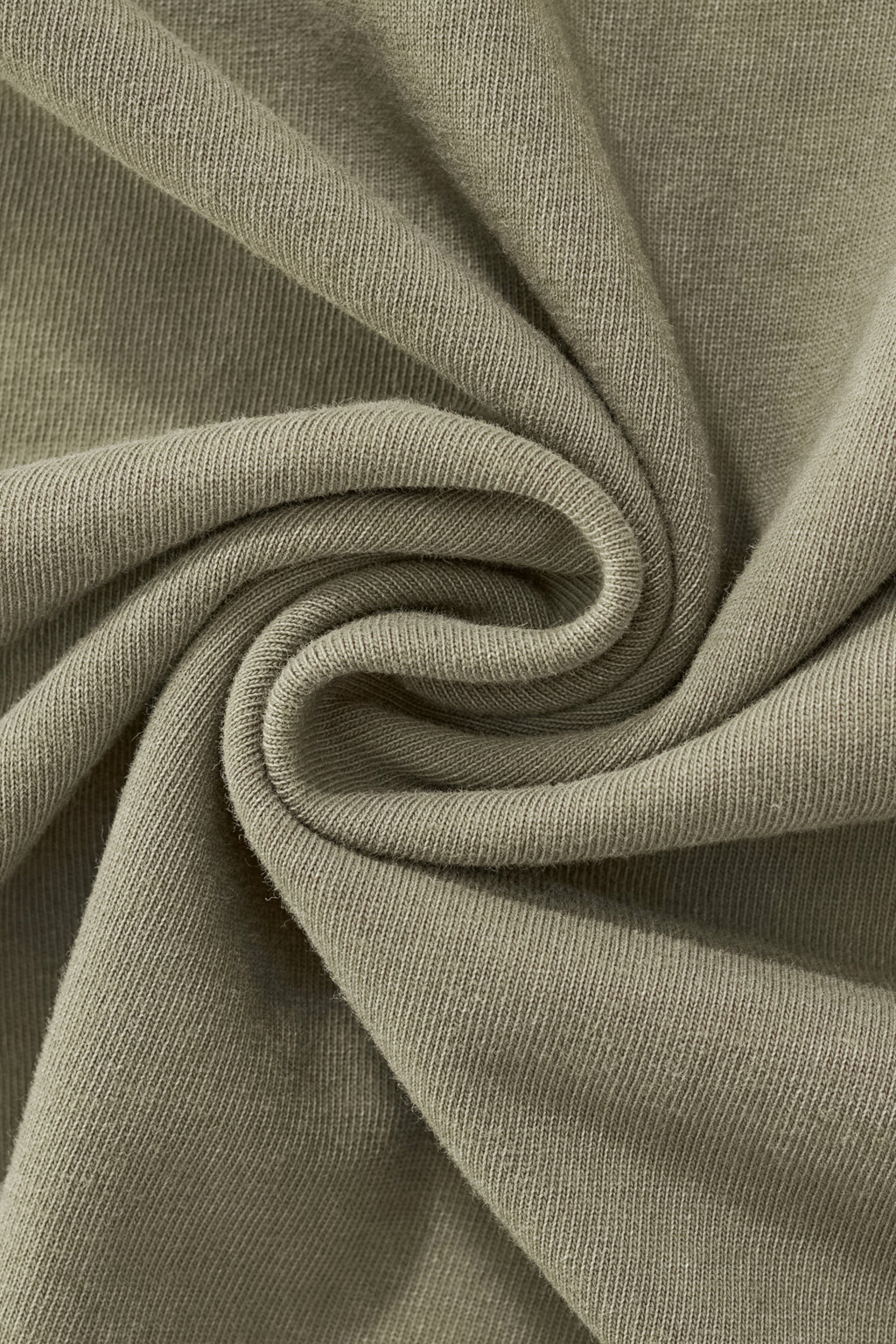 Close-up of the Trini Born Culture Tee Arrival Edition premium 100% cotton fabric showcasing its soft heavyweight texture, durable knit, and quality craftsmanship for luxury Caribbean streetwear.