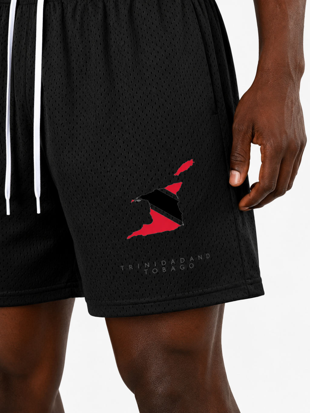Trini Born black mesh shorts on model, front view with Trinidad and Tobago map graphic and white drawstring.
