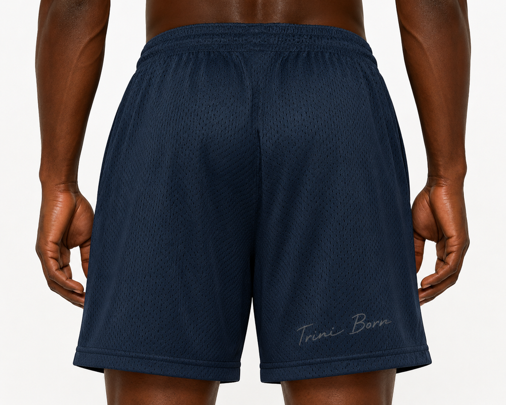 Close-up of Trini Born navy mesh shorts back showing breathable mesh and Trini Born script detail.