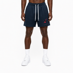 Trini Born navy mesh shorts on model, front view with Trinidad and Tobago map graphic and white drawstring.