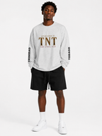 Close-up of the back of the oat gray Trini Born Steelpan Heritage oversized long sleeve showing steelpan musicians, sunset artwork and Trini Born branding.