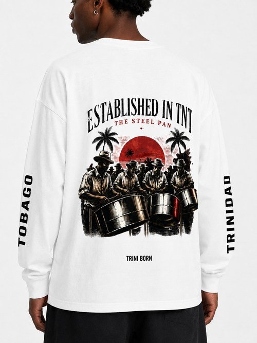 Back view of Black male model wearing the white Trini Born Steelpan Heritage oversized long sleeve with steelpan musician artwork and Trinidad and Tobago sleeve text.