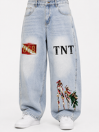 Black male model wearing Trini Born vintage wash barrel leg jeans in light blue, front view with 868, TNT, and Trinidad carnival stilt performer graphics.
